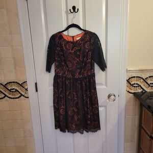 Shoshanna black lace cocktail dress with coral underlay